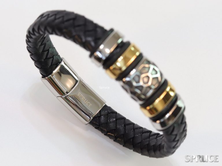 Black leather bracelet with silver and gold accessories