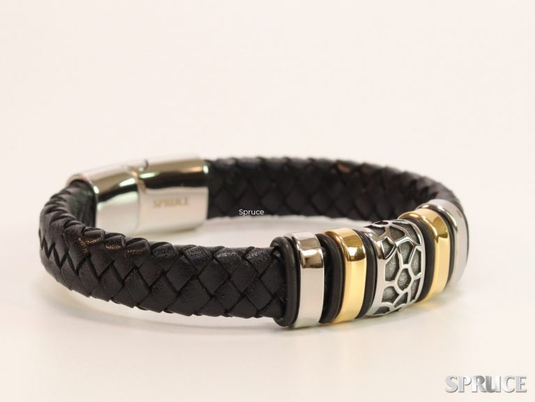 Black leather bracelet with silver and gold accessories