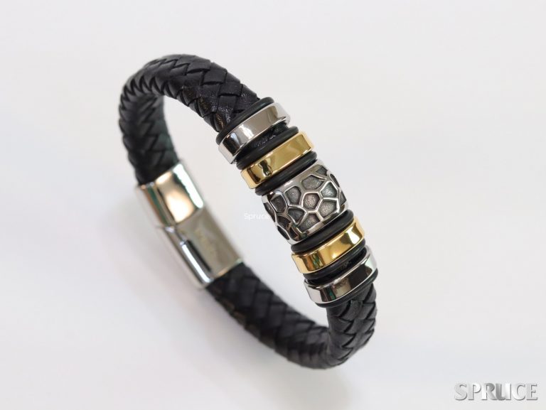 Black leather bracelet with silver and gold accessories